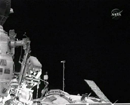 Astronauts Whack Golf Ball and Outfit Station in Spacewalk